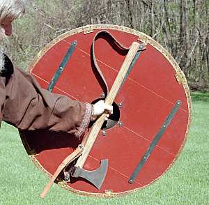 ax held in same hand as shield