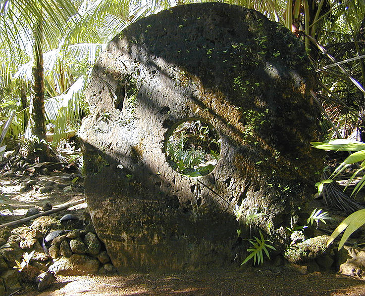 huge stone coin standing in jungle